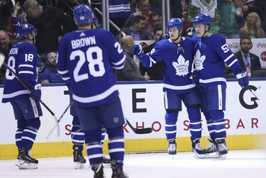 Toronto Maple Leafs William Nylander RW (29) celebrates the power play goal to open the scoring with  Jake Gardiner D (51) during the first period in Toronto on Saturday March 17, 2018. Jack Boland/Toronto Sun/Postmedia Network