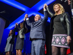 Ontario PC Leader Doug Ford is joined with Tanya Granic Allen (from left), Caroline Mulroney and Christine Elliott (on the right) on the stage at the PC Unity Rally at the Toronto Congress Centre in Toronto, Ont. on Monday March 19, 2018. Ernest Doroszuk/Toronto Sun/Postmedia Network