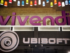 A combination of files pictures made March 20, 2018, shows on the top, the French media group Vivendi logo on April 24, 2008, in Paris, and the French video game publisher Ubisoft logo on October 27, 2016 in Paris