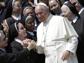 Pope Francis is greeted by nuns in St. Peter's Square on the occasion of a jubilee audience, at the Vatican, Thursday, June 30, 2016.