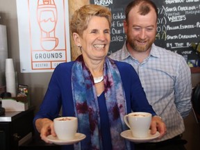 Premier Kathleen Wynne with the two cups of espresso she made with a little help from Stomping Grounds owner Phil Gilmore at a meet-and-greet on Thursday March 15, 2018 in Cornwall, Ont. Alan S. Hale/Cornwall Standard-Freeholder/Postmedia Network
