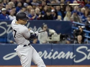New York Yankees' Giancarlo Stanton shatters his bat on a pitch by Jays starter Aaron Sanchez in Toronto on Friday, March 30, 2018. (THE CANADIAN PRESS/Fred Thornhill)