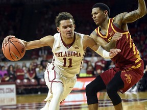 Oklahoma's Trae Young, left, drives past Iowa State's Donovan Jackson in the second half of an NCAA basketball game Friday, March 2, 2018, in Norman, Okla. (AP Photo/Kyle Phillips)