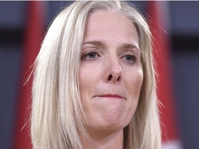 Minister of Environment and Climate Change Catherine McKenna listens to a question during a press conference on the government's environmental and regulatory reviews related to major projects, in the National Press Theatre in Ottawa on Thursday, Feb. 8, 2018.