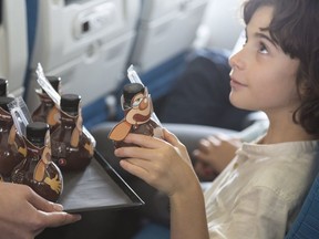 A boy chooses one of the kid-friendly beverages served to kids aboard Turkish Airlines.