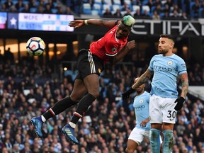 Manchester United midfielder Paul Pogba scores his team's second goal against Manchester City on Saturday. (GETTY IMAGES)