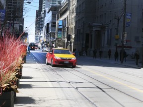 An empty-looking King St. W. on Friday April 20, 2018.
