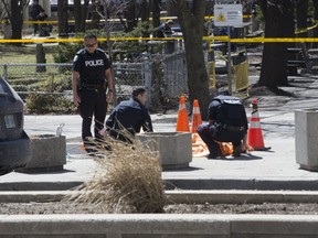 Police attend the scene after a van struck several people along Yonge Street in North York on Monday.