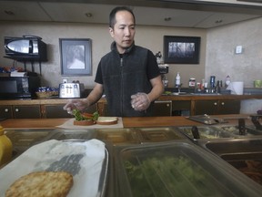 Mike Chung, owner of the Deja Vu cafe, at the Ajax Go bus terminal. (JACK BOLAND, Toronto Sun)
