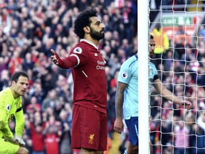 Liverpool's Mohamed Salah celebrates scoring his side's second goal of the game against Bournemouth on Saturday (AP PHOTO)