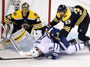 Boston Bruins defenceman Zdeno Chara hits Toronto Maple Leafs centre Zach Hyman during Wednesday night's game. (AP PHOTO)