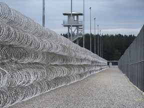 In this Feb. 9, 2016, file photo, razor wire protects a perimeter of the Lee Correctional Institution in Bishopville, S.C. A South Carolina prisons spokesman says several inmates are dead and others required outside medical attention after hours of fighting inside the maximum security prison. (AP Photo/Sean Rayford, File)