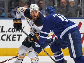 Ryan O'Reilly of the Buffalo Sabres skates with the puck against Zach Hyman of the Toronto Maple Leafs during an NHL game at the Air Canada Centre on Monday. (Claus Andersen/Getty Images)