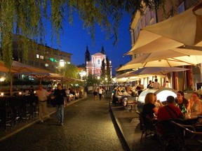 Ljubljana’s riverfront promenade is lined with quaint boutiques, great restaurants, and cafes ripe for people-watching. CAMERON HEWITT PHOTO