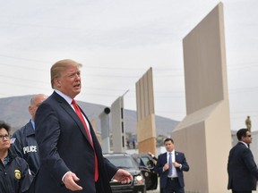 U.S. President Donald Trump inspects border wall prototypes in San Diego, Calif., on March 13, 2018.