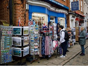 People shop for royal wedding souvenirs in Windsor. TOLGA AKMEN/GETTY IMAGES