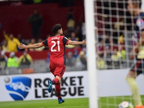Toronto FC's Jonathan Osorio (L) celebrates his goal during the second leg CONCACAF Champions League semifinals match against Mexico´s America at Azteca stadium in Mexico City on April 10, 2018. / AFP PHOTO / PEDRO PARDOPEDRO PARDO/AFP/Getty Images