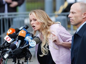 Adult-film actress Stephanie Clifford, also known as Stormy Daniels speaks US Federal Court with her lawyer Michael Avenatti (R) on April 16, 2018, in Lower Manhattan, New York.