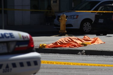 An unidentified body is seen near the crime scene after a truck hit several pedestrians in Toronto, Ontario, on on April 23, 2018.  LARS HAGBERG/AFP/Getty Images