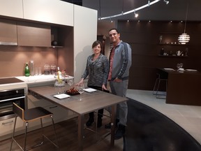 Sandra Mendes and Nelson Costa of AyA Kitchen and Baths show small space solutions for condos which include a pull out table.
