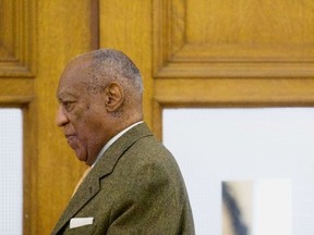 Bill Cosby, center, walks towards the courtroom as he arrives at the Montgomery County Courthouse during his sexual assault retrial on Thursday, April 12, 2018, in Norristown, Pa. (Mark Makela/Pool Photo via AP)