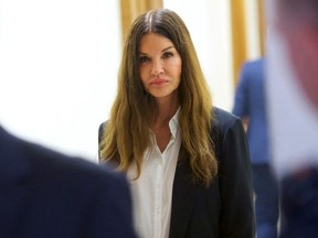 Janice Dickinson walks through the Montgomery County Courthouse during a break in Bill Cosby's sexual assault retrial on Thursday, April 12, 2018, in Norristown, Pa. (Mark Makela/Pool Photo via AP) ORG XMIT: PABC208