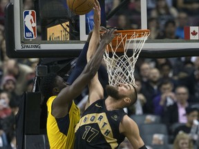 Jonas Valanclunas defends the Raptors basket in the first half as the Toronto Raptors take on the Indiana Pacers at the Air Canada Centre in Toronto on April 6, 2018