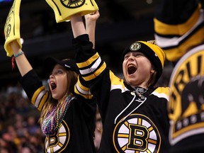 Young fans cheer on the Boston Bruins at TD Garden on April 7, 2018 in Boston. (Maddie Meyer/Getty Images)