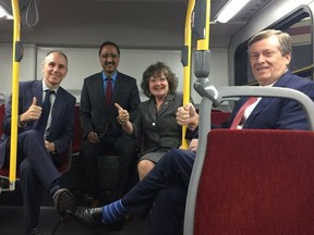 TTC Chair Josh Colle, from left, federal Infrastructure Minister Amarjeet Sohi, Ontario Transportation Minister Kathryn McGarry and Toronto Mayor John Tory on a TTC bus during an infrastructure announcement on Monday, April 23, 2018. (@johntory)