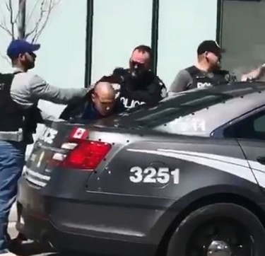 A man is taken into custody after pedestrians were struck on Yonge St. in Toronto on April 23, 2018. (@FTV_Huazhang)