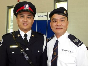 Const. Ken Lam, left, with his father David. (Sing Tao Daily)