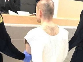 Alek Minassian is pictured while being booked at the Toronto South Detention Centre.