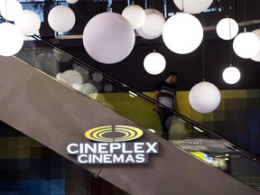 A man makes his way down an escalator during the Cineplex Entertainment company's annual general meeting in Toronto on Wednesday, May 17, 2017. Cineplex Inc. is laying off "a number of" full-time workers. The entertainment giant is refusing to say exactly how many employees are being cut, but says the move impacts less than 100 employees.THE CANADIAN PRESS/Nathan Denette