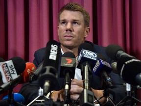 Australian cricketer David Warner listens to a question at a press conference at the Sydney Cricket Ground (SCG) in Sydney on March 31, 2018