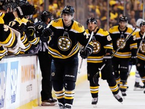 Boston Bruins' Jake DeBrusk leads teammates back to the bench after scoring against the Toronto Maple Leafs during Game 2 at TD Garden on April 14, 2018