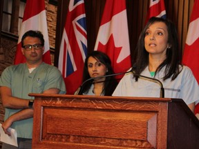 Dr. Deron Brown, Dr. Kulvinder Gill  and Dr. Ashvinder Lamba peak at Queen's Park on Tuesday, April 3, 2018. (Antonella Artuso/Toronto Sun).