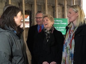 Ontario Premier Kathleen Wynne, centre, with Federal Environment Minister Catherine McKenna at a funding announcement in Toronto on Wednesday, April 4, 2018. (@cathmckenna)