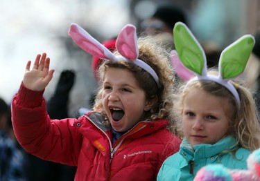 Children wait for their first look at the Easter Bunny as the annual Toronto Beaches Lions Club Easter Parade hops along Queen St in Toronto  on Sunday April 1, 2018. Dave Abel/Toronto Sun/Postmedia Network
