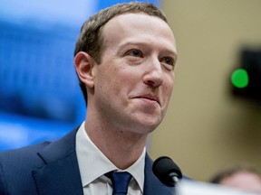 Facebook CEO Mark Zuckerberg pauses while testifying before a House Energy and Commerce hearing on Capitol Hill in Washington, Wednesday, April 11, 2018, about the use of Facebook data to target American voters in the 2016 election and data privacy.