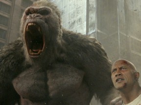 (L-r) Jason Liles as George and Dwayne Johnson as Davis Okoye in "Rampage." MUST CREDIT: Warner Bros. Pictures.