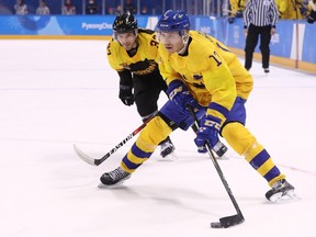 Par Lindholm #17 of Sweden controls the puck against Patrick Reimer #37 of Germany  during the Men's Play-offs Quarterfinals game on day twelve of the PyeongChang 2018 Winter Olympic Games at Kwandong Hockey Centre on February 21, 2018 in Gangneung, South Korea.  (Photo by Maddie Meyer/Getty Images)