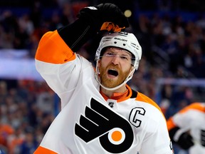 In this March 3, 2018, file photo, Philadelphia Flyers center Claude Giroux (28) celebrates after scoring against the Tampa Bay Lightning during the third period of an NHL hockey game in Tampa