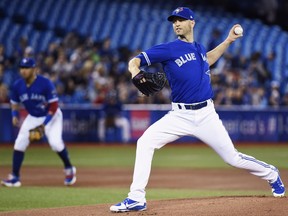Toronto Blue Jays starting pitcher J.A. Happ (33) works against the Texas Rangers during first inning AL baseball action in Toronto on Sunday, April 29, 2018. (THE CANADIAN PRESS/Nathan Denette)