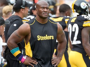 In this Oct. 8, 2017 file photo, Pittsburgh Steelers linebacker James Harrison walks the sidelines as his team plays against the Jacksonville Jaguars in an NFL football game in Pittsburgh