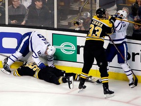 In this April 12, 2018, file photo, Boston Bruins defenceman Zdeno Chara shoves Toronto Maple Leafs centre Nazem Kadri  to retaliate for his late hit on Boston Bruins centre Tommy Wingels, bottom left, as Maple Leafs centre Mitchell Marner starts to get up during the third period of Game 1 of an NHL hockey first-round playoff series, in Boston.  (AP Photo/Elise Amendola)