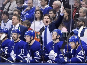 Toronto Maple Leafs coach Mike Babcock reacts during third period NHL round one playoff hockey action against the Boston Bruins in Toronto on Thursday, April 19, 2018.