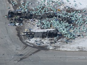 The wreckage of a fatal crash outside of Tisdale, Sask., is seen Saturday, April, 7, 2018. A bus carrying the Humboldt Broncos hockey team crashed into a truck en route to Nipawin for a game Friday night killing 14 and sending over a dozen more to the hospital. THE CANADIAN PRESS/Jonathan Hayward ORG XMIT: JOHV130