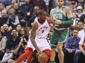 Raptors forward Serge Ibaka carries the ball agaisnt the Boston Celtics on Wednesday night at the Air Canada Centre. (Veronica Henri/Toronto Sun)