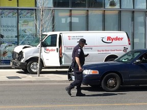 Toronto Police with a Ryder van believed to have hit multiple pedestrians on Yonge St. in Toronto on April 23, 2018. (Craig Robertson/Toronto Sun)