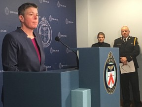 Toronto Police Det.-Const. Janelle Blackadar provides details of an international investigation into online child sex abuse, dubbed Project Mercury, at Toronto Police Headquarters on Thursday, April 12, 2018, as Const. Caroline de Kloet and Toronto Police Staff-Supt. Myron Demkiw look on.